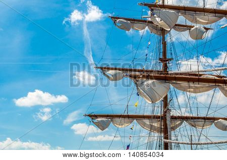 a big sail ship by the harbor