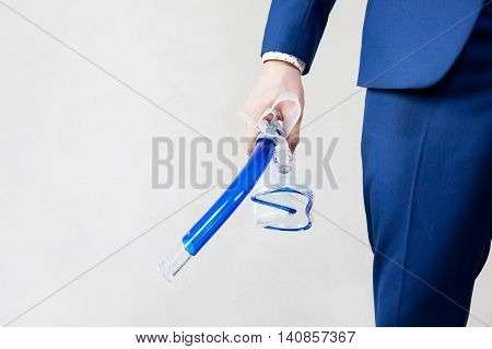 Businessman Holding Snorkeling Goggle In White Background - Business Vacation Concept
