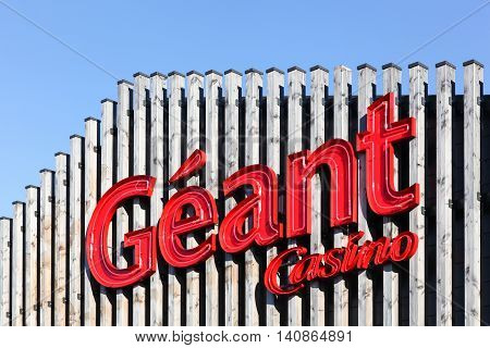 Villefranche sur Saone, France - July 15, 2016: Geant Casino logo on a facade. Geant Casino is a hypermarket chain based in Saint Etienne, France