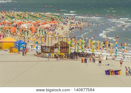 Mamaia Romania - July 18 2016:People enjoying on beach in Mamaia Mamaia is the best known resort on Romanian Riviera.It's situated on 8km long and 300m wide sandy land at the Black Sea.
