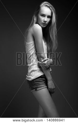 Fashion Model With Long Hair, Beautiful Eyes, Perfect Skin Is Posing In Studio For Glamour Test Phot