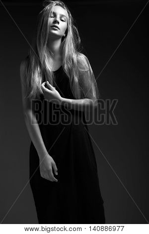 Fashion Model With Long Hair, Beautiful Eyes, Perfect Skin Is Posing In Studio For Glamour Test Phot
