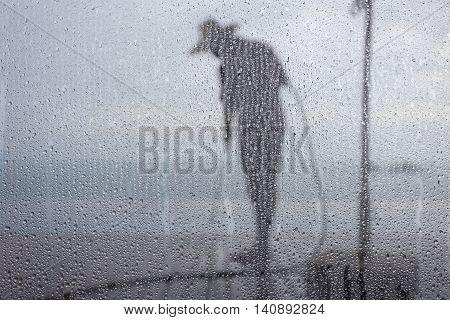 Blurred People Washing Decking By Pressure Wash. Focus On Water Drop
