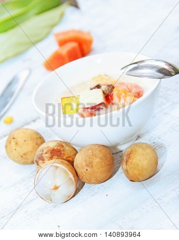 Fruit salad of tropical fruits on table
