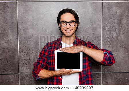 Handsome Young Man In Glasses Showing Screen Of Digital Tablet