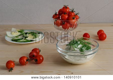 Breakfast with tomatoes and sour cream egg cucumber dill