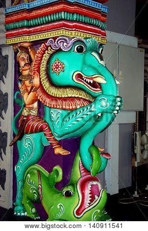 Singapore - December 16 2007: Turquoise elephant statue with Indian man astride its back at the Sri Shrimivasa Perumal Hindu temple in Little India *