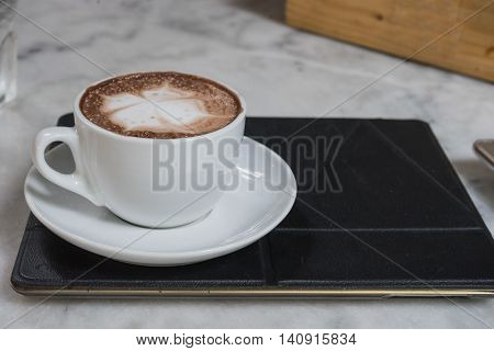 hot fresh coffee in white cup on marble table on tablet and white saucer cappuccino coffee mocha coffee espresso coffee latte coffee
