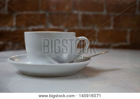 hot fresh coffee in white cup on wooden table brick wall and white saucer coffee bean cappuccino coffee mocha coffee espresso coffee latte coffee