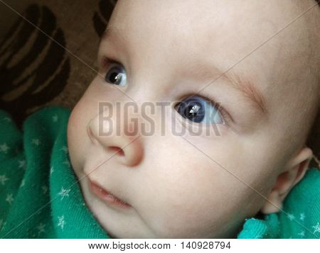 Closeup blue eyes of cute little baby boy.