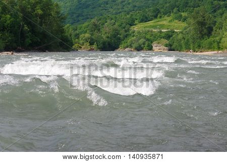 Waves on a mountain river in summer. Caucasus