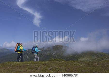 Hiking in the mountains in the summer on a sunny day.