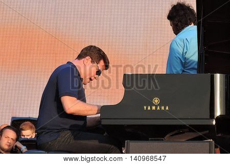 MOSCOW - AUGUST 01, 2016: Piany player Denis Matsuev performs at open air free entrance concert at VDNH park in Moscow. Celebration of VDNH foundation anniversary (77 years).