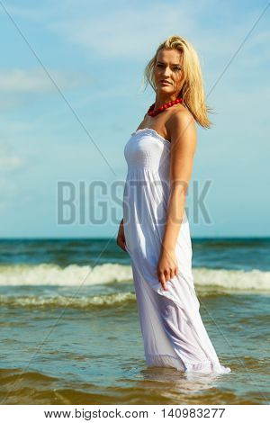 Attractive Blonde Woman On The Beach.