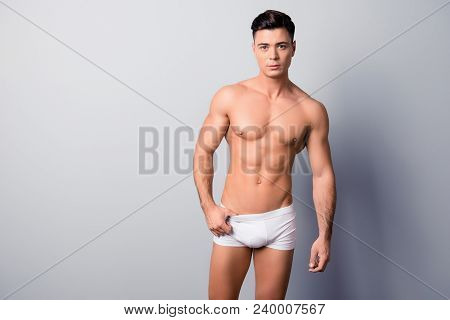 Portrait Of Handsome Sexy Virile Muscular With Modern Hairstyle Gut, He Is Posing In White Underwear