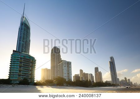 The Autumn Sun Sets Behind Broadbeach Skyline After A Warm Day In The Gold Coast, Queensland, Austra