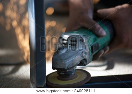 The Worker Is Welding Metal Part Of Table Steel In Factory.