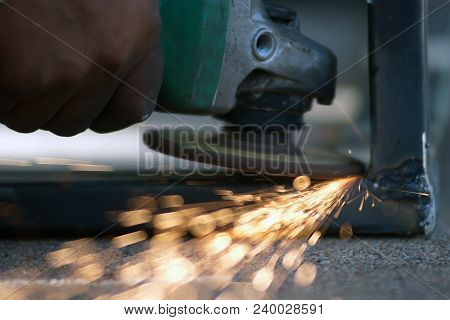 The Worker Is Welding Metal Part Of Table Steel In Factory.