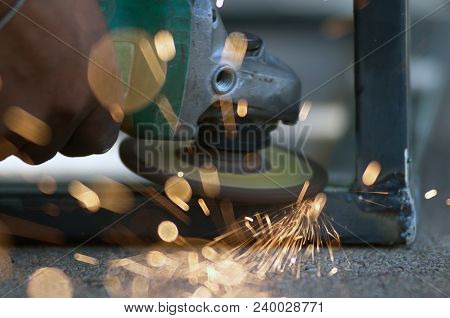 The Worker Is Welding Metal Part Of Table Steel In Factory.