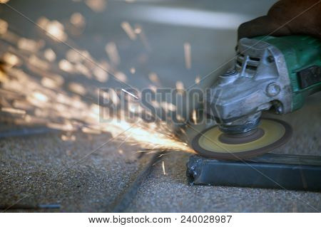 The Worker Is Welding Metal Part Of Table Steel In Factory.