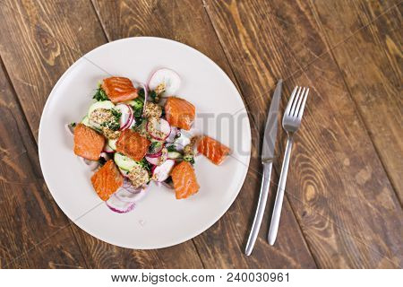 Red Fish Salmon With Radish And Spinach, Served On White Plate On Wooden Table. Rustick Style. View 