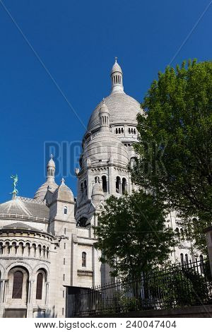 The Basilica Sacre Coeur Is A Roman Catholic Church Located At The Summet Of The Butte Montmartre , 