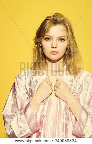 One Sleepy Young Sensual Strange Blonde Woman In Satin Pink Dressing Gown In Soft Flower Pattern Pas