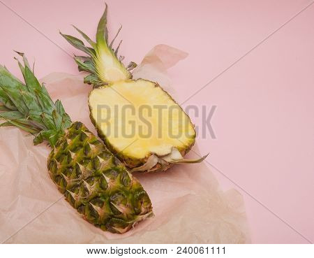 Half Cut Juicy Pineapple On A Pastel Pink Background. Minimal Summer Concept.