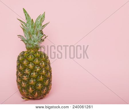 Half Cut Juicy Pineapple On A Pastel Pink Background. Minimal Summer Concept.