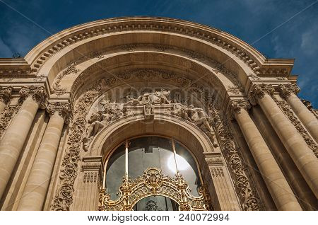 Paris, France - July 11, 2017. Close-up Of The Far-fetched Golden Gate And Arch In A Sunny Day At Th