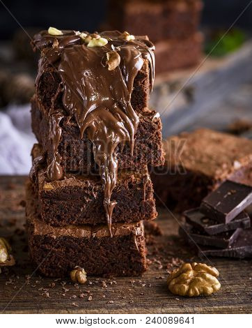 A Stack Of Baked Brown Brownie Pie, Dessert Is Poured With A Thick Layer Of Chocolate, Close Up