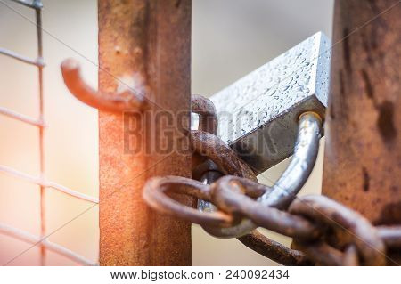 The Lock On A Chain On A Gate, It Is Rainy