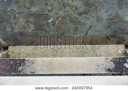 Descend Grey Concrete Stairs Into The Water, Concept Photography