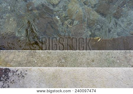 Descend Grey Concrete Stairs Into The Water, Concept Photography