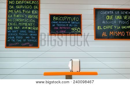 Malaga, Spain - April 25, 2018. Meal At The Coffee Shop With Napkin Support And Chalk On The Board