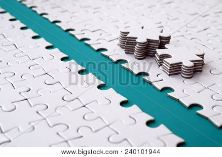 The Blue Path Is Laid On The Platform Of A White Folded Jigsaw Puzzle. The Missing Elements Of The P