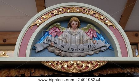 STITAR, CROATIA - NOVEMBER 30: Angel with Gloria in excelsis Deo Banner, Nativity Scene, altarpiece in the church of Saint Matthew in Stitar, Croatia on November 30, 2017.