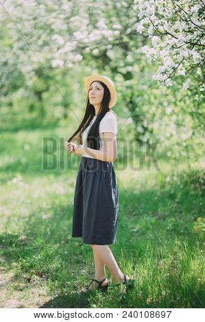 Happy Laughing Girl Holding Straw Walking In The Green Summer Park