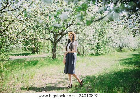 Happy Laughing Girl Holding Straw Walking In The Green Summer Park