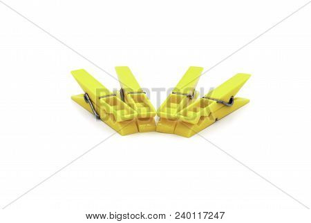Four Yellow Angled Pegs On White Background