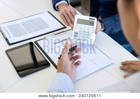 Businessman Being Analysis And Making The Decision A Car Insurance Policy, Agent Man Is Holding The 