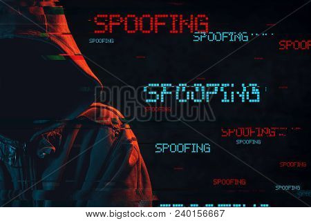 Spoofing Concept With Faceless Hooded Male Person, Low Key Red And Blue Lit Image And Digital Glitch