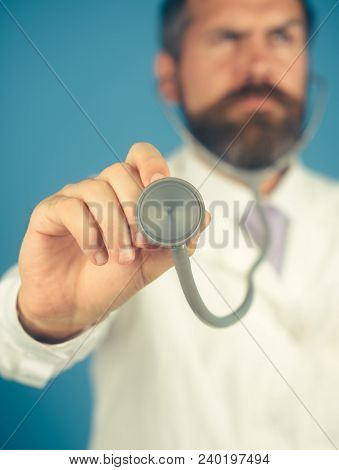Doctor With Stethoscope In Hand, Focus On Stethoscope. Diagnostic Instrumen, Hospital Equipment. Hea