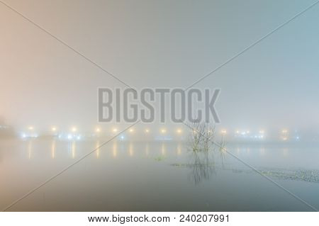 Abstact Blurred Background Of Uttamanusorn Bridge Or Mon Bridge With Light Reflection On River In Th