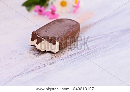 Classic Delicious  Vanilla  Ice Cream Covered Whit Chocolate At Light Wooden Background