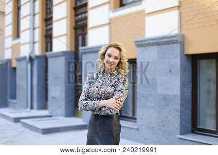 Female Teacher Standing Near University Building Outdoors. Concept Of Education And Beauty.