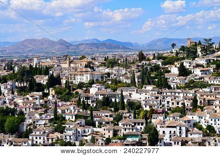 White Houses Of El Albayzin Neighbourhood Over The Hills Of Granada In Andalusia, Spain
