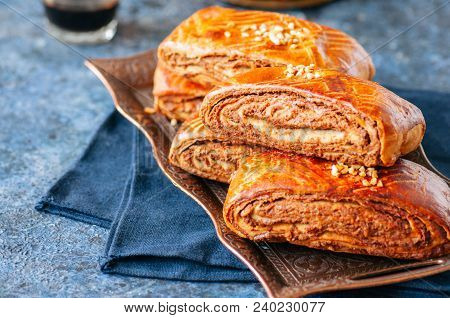 Traditional Turkish Pastry Roll With Chocolate And Nuts Filling - Pastich Served On A Vintage Tray.