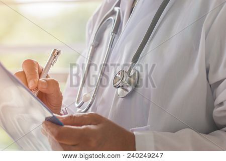 Healthcare And Medical Concept, Doctor Working Seaching Information Patient Database Through Interne