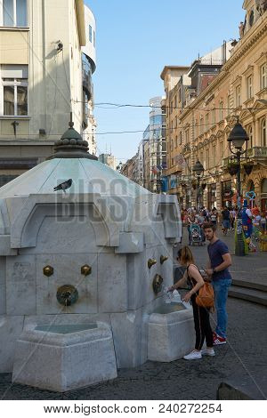 Belgrade, Serbia - May 01, 2018: People Drink Water At Delijska Chesma Tourist Attraction.